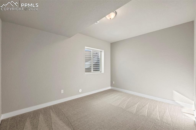 unfurnished room featuring carpet flooring