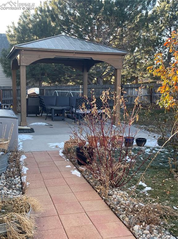 view of patio featuring a gazebo and an outdoor living space