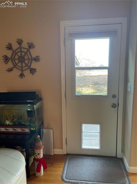 doorway featuring light hardwood / wood-style floors