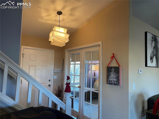 entryway with french doors and lofted ceiling