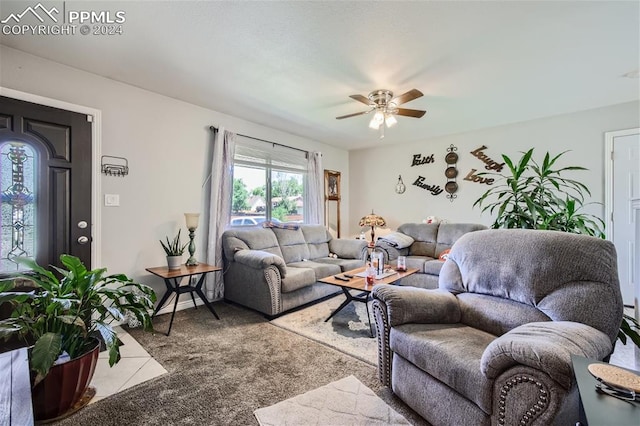 carpeted living room with ceiling fan