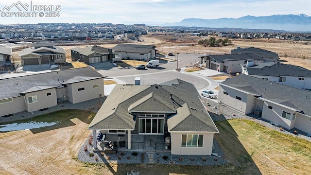 birds eye view of property featuring a mountain view