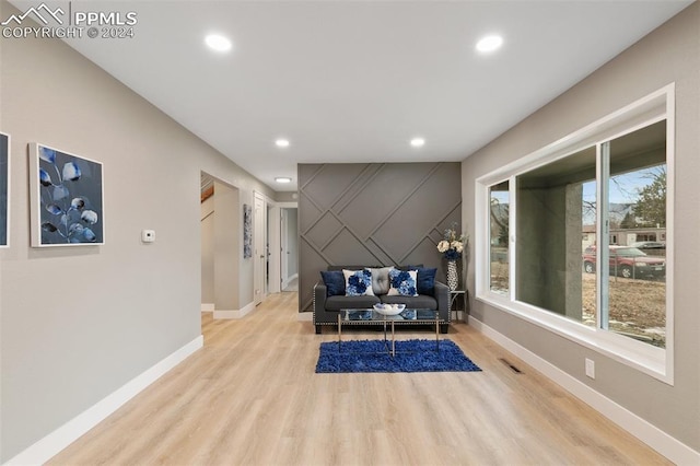 living room with light hardwood / wood-style flooring