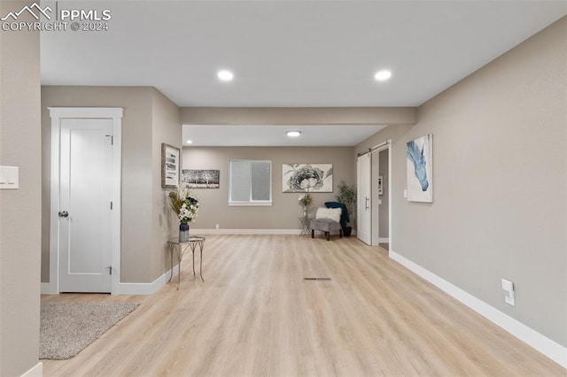 corridor with light wood-type flooring