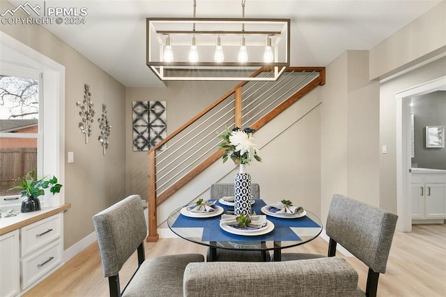 dining space with light hardwood / wood-style flooring