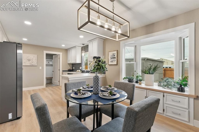 dining room with light hardwood / wood-style floors