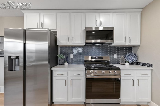 kitchen featuring white cabinets and appliances with stainless steel finishes