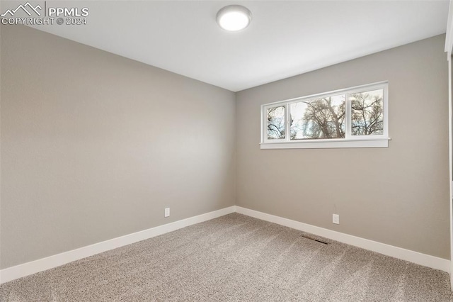 view of carpeted spare room