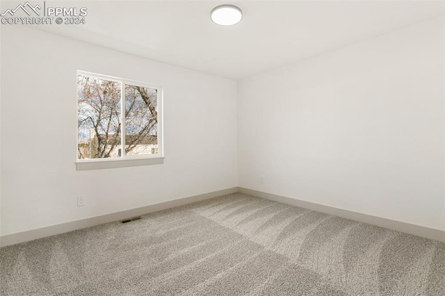 empty room featuring carpet flooring