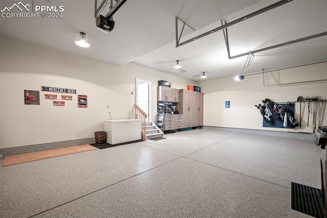 garage featuring a garage door opener