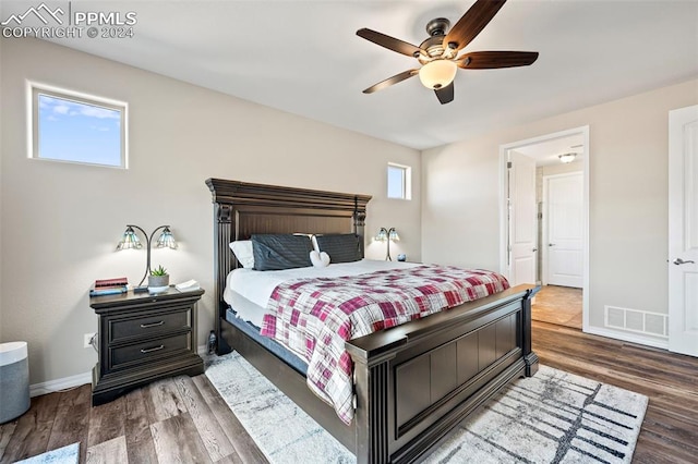 bedroom with hardwood / wood-style floors and ceiling fan