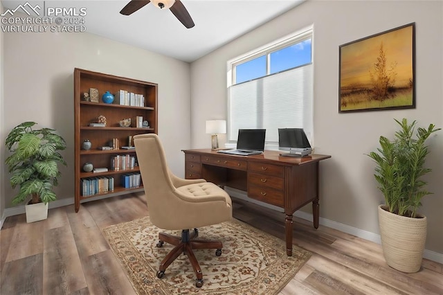 office space featuring ceiling fan and light wood-type flooring