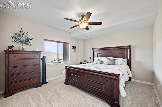 bedroom featuring light colored carpet and ceiling fan