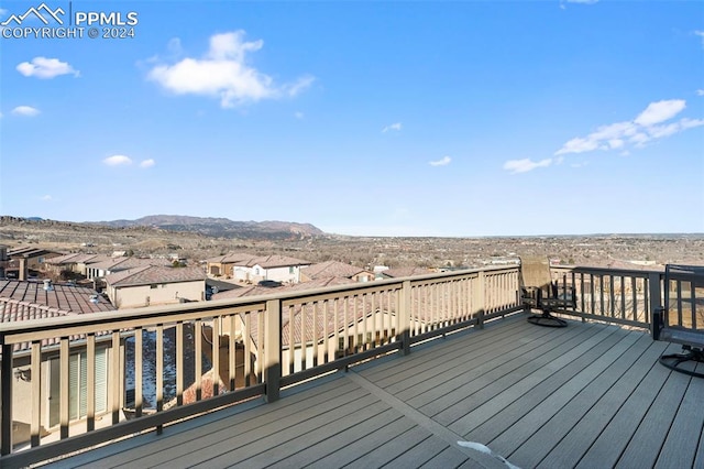 wooden deck with a mountain view