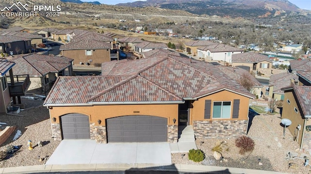 birds eye view of property with a mountain view