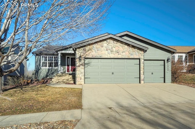 ranch-style home with a garage