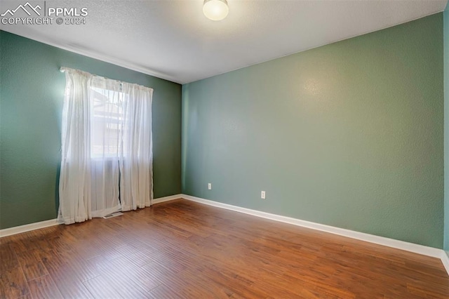 empty room featuring hardwood / wood-style floors