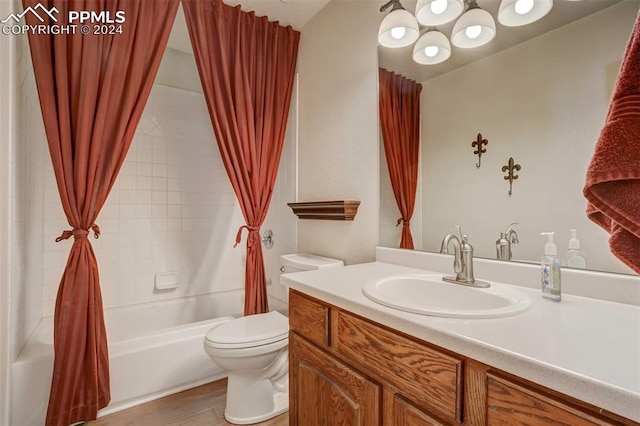 full bathroom featuring shower / bath combo, vanity, toilet, and hardwood / wood-style floors