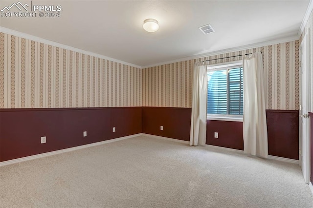 carpeted empty room with ornamental molding