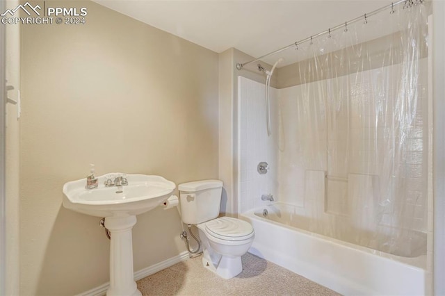 bathroom featuring shower / tub combo with curtain and toilet