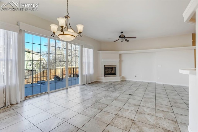 unfurnished living room featuring light tile patterned floors and ceiling fan with notable chandelier