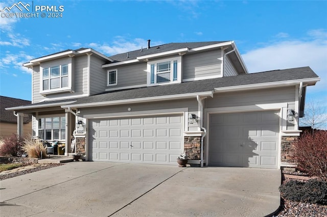 view of front of property with a garage