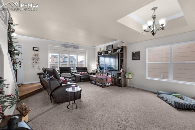 living room featuring carpet, ornamental molding, and a notable chandelier