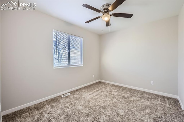 unfurnished room with ceiling fan and carpet floors