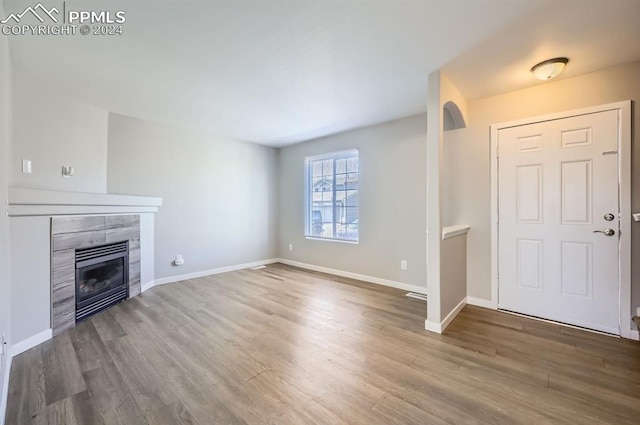 entryway featuring a fireplace and hardwood / wood-style flooring