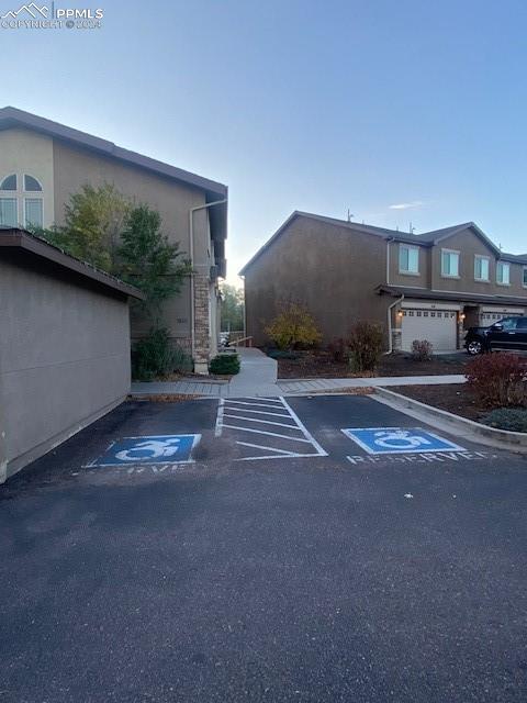 view of car parking with a garage