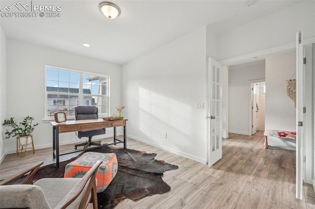 office with light hardwood / wood-style floors