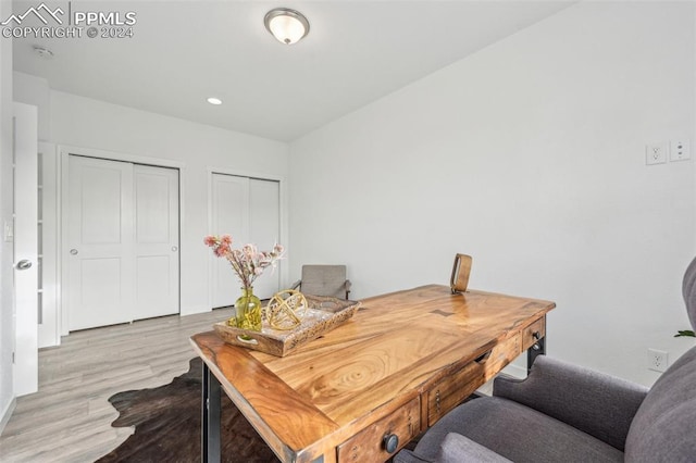 home office with light wood-type flooring