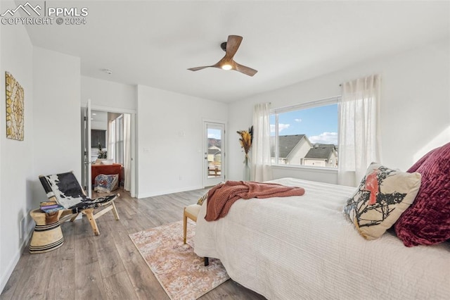 bedroom featuring light hardwood / wood-style flooring and ceiling fan