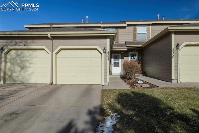 view of front of property with a garage