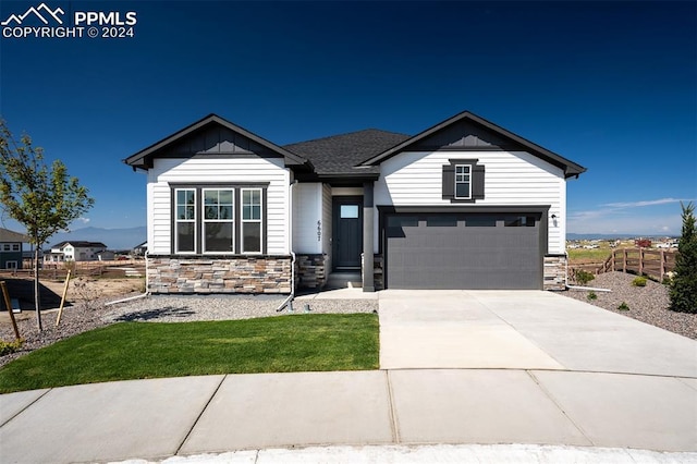 view of front facade with a front lawn and a garage