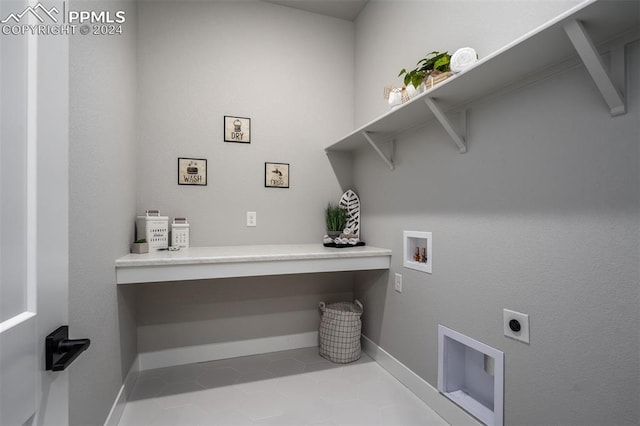 clothes washing area featuring hookup for an electric dryer, light tile patterned floors, and hookup for a washing machine