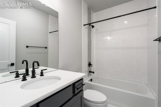 full bathroom with vanity, toilet, and tiled shower / bath