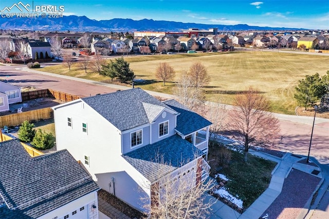 birds eye view of property with a mountain view