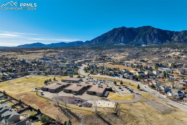 birds eye view of property featuring a mountain view