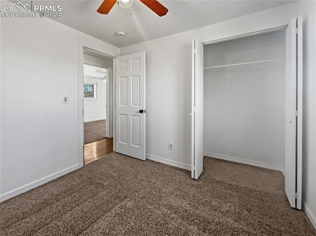 unfurnished bedroom with carpet floors, a closet, and ceiling fan