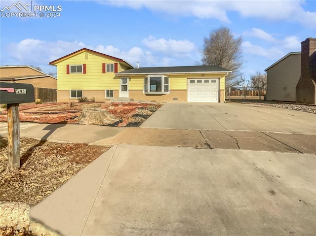 split level home featuring a garage