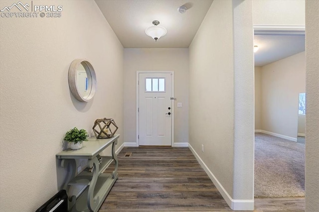 entryway with dark wood-type flooring