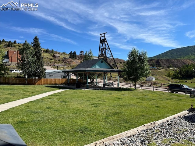 view of home's community featuring a gazebo, a mountain view, and a yard