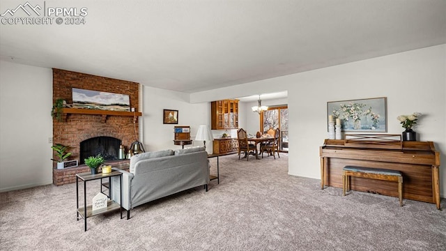 living room featuring carpet floors, a fireplace, and an inviting chandelier