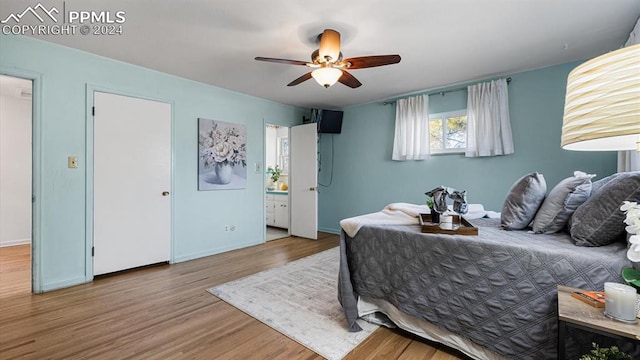 bedroom with ensuite bath, ceiling fan, and wood-type flooring