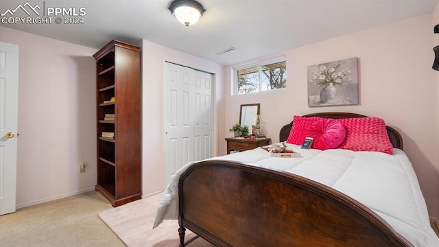 carpeted bedroom featuring a closet