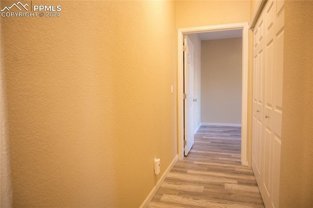 corridor featuring light hardwood / wood-style flooring