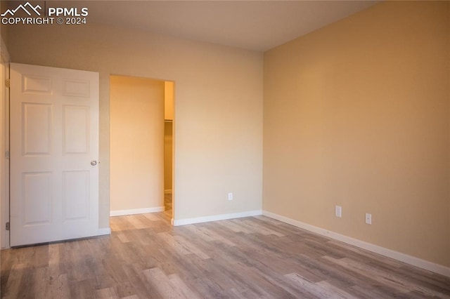 unfurnished bedroom featuring hardwood / wood-style floors