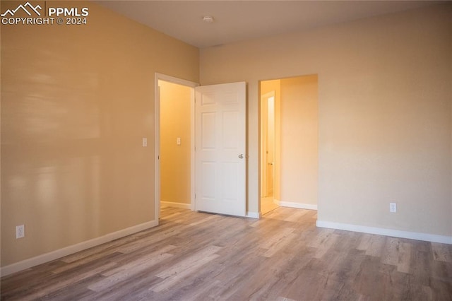 unfurnished bedroom with wood-type flooring