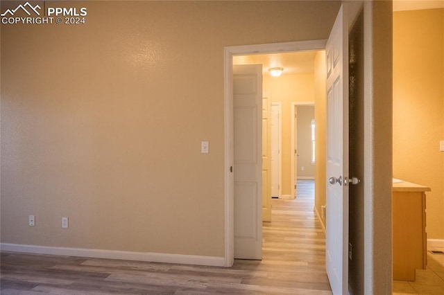 corridor featuring light hardwood / wood-style flooring